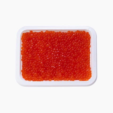 Open 16 oz tray of Wild Alaska Chum Salmon Ikura XIP, Grade 1, filled with large, glossy orange-red salmon roe.